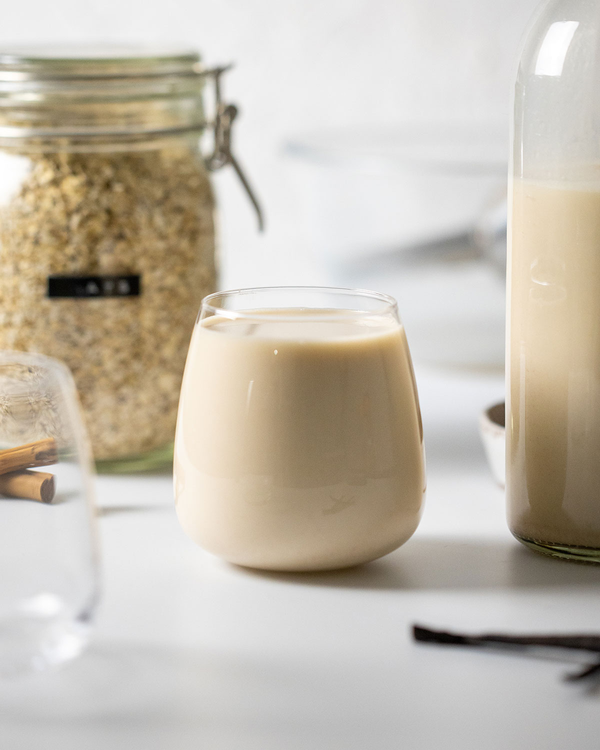 a glass full of easy homemade gluten free oat milk