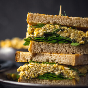 chickpea tuna sandwich on a black plate