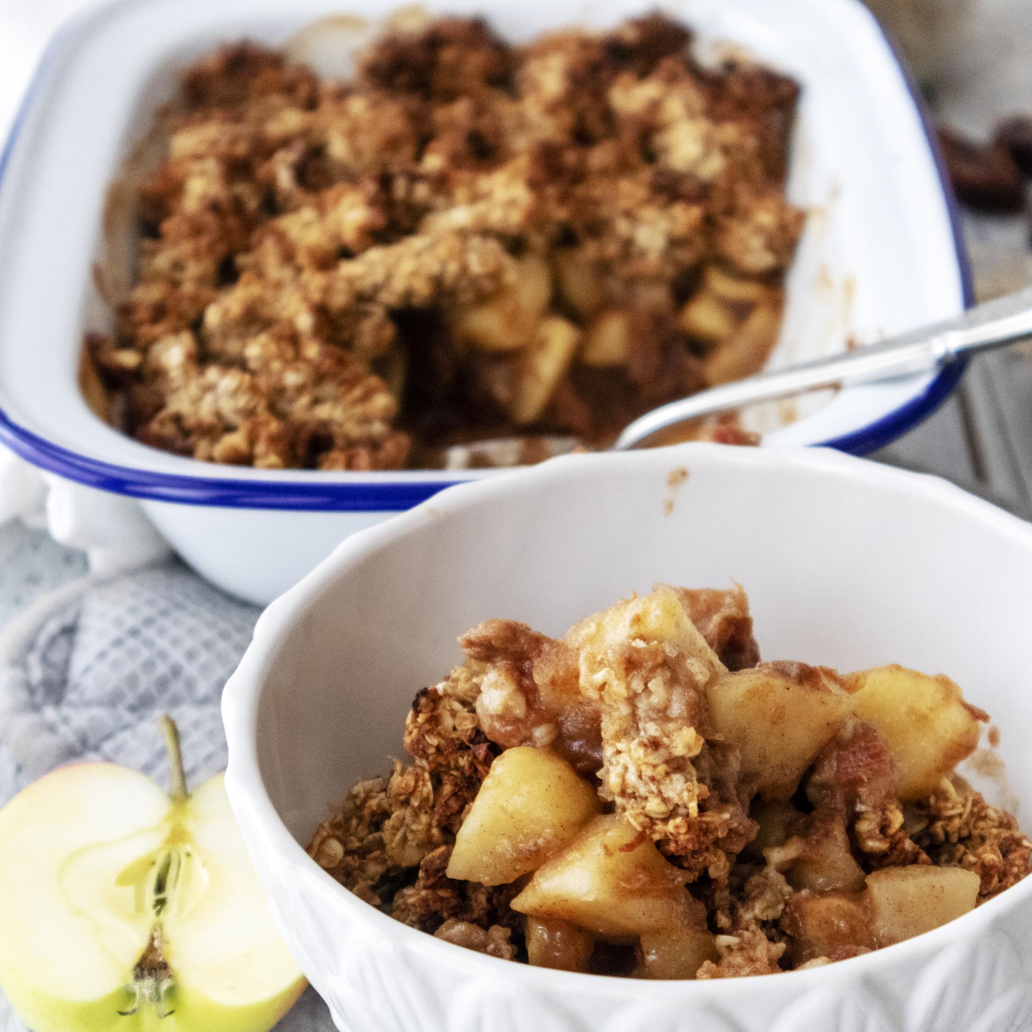 Breakfast Crumble in a white bowl in front of an oven dish