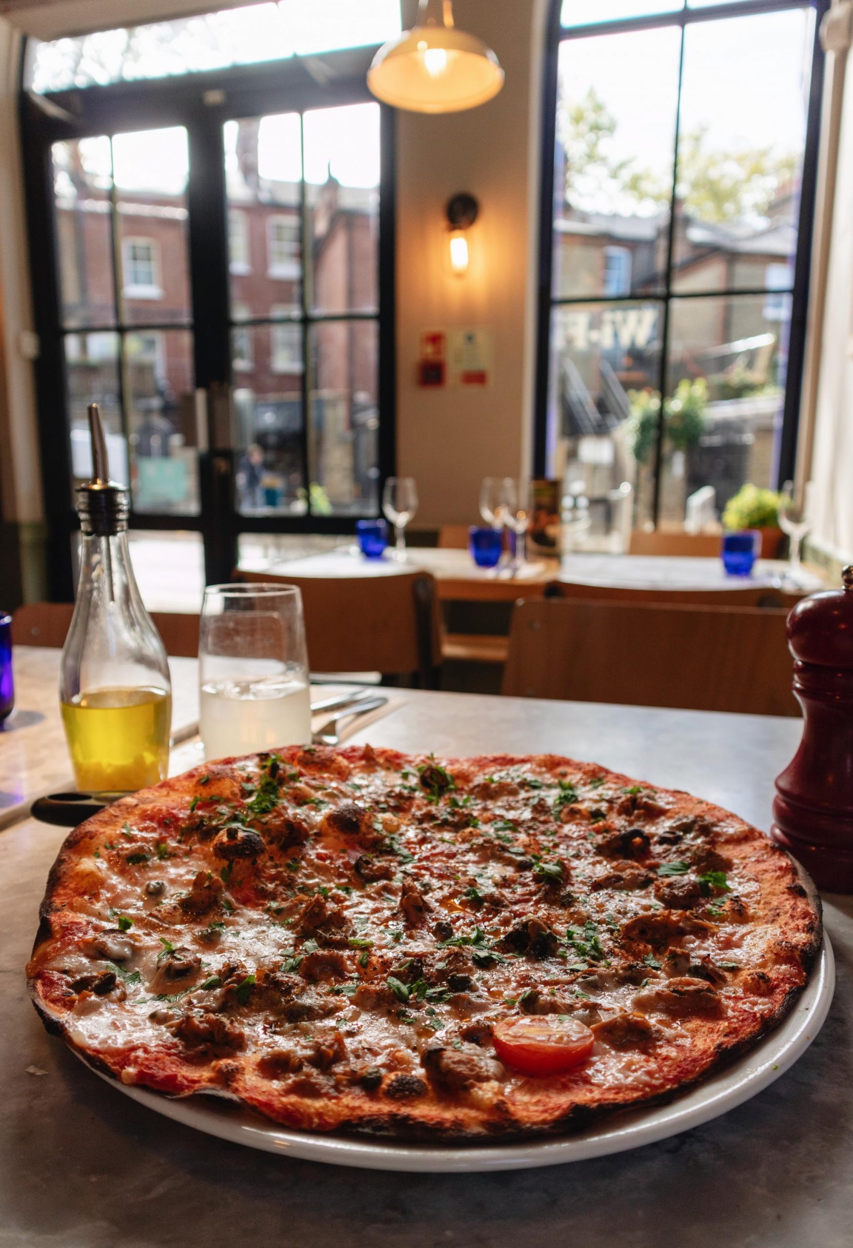 whole vegan pizza at pizza express on a table