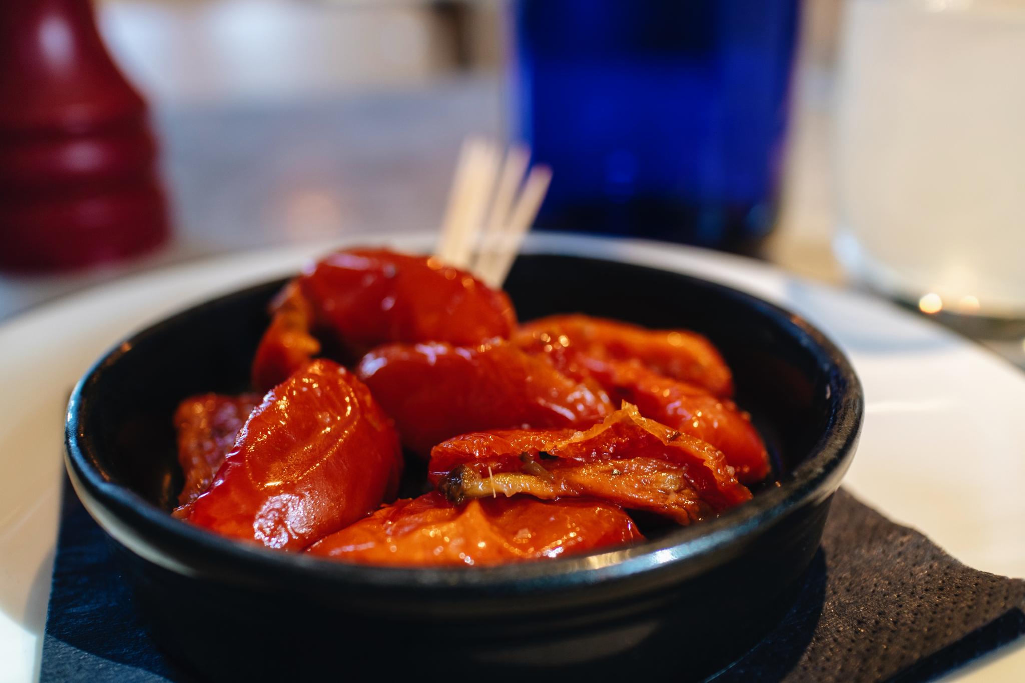 roasted tomatoes at pizza express in a black dish