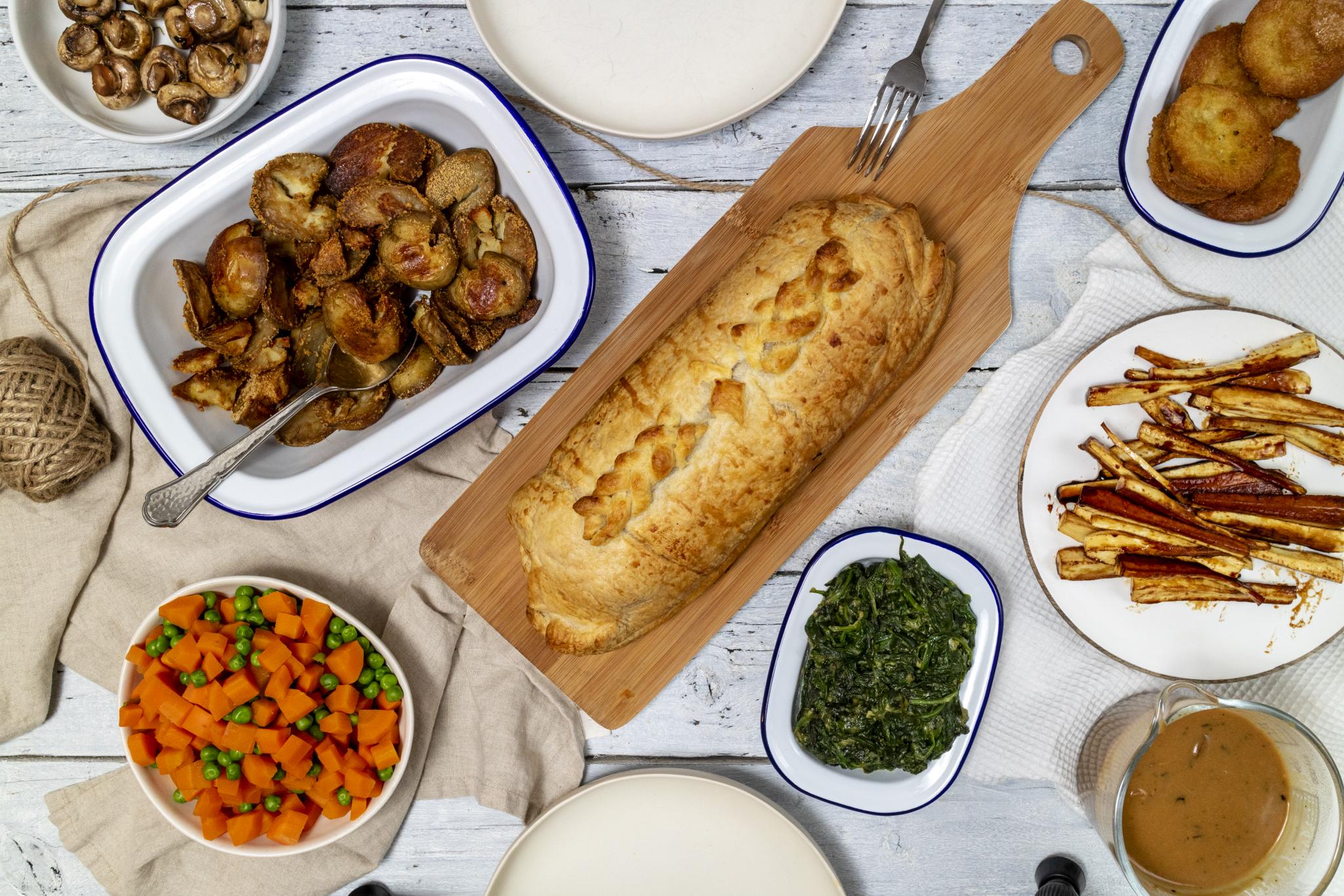 Festive Vegan Seitan Wellington Recipe photographed from above on a festive table setting, 