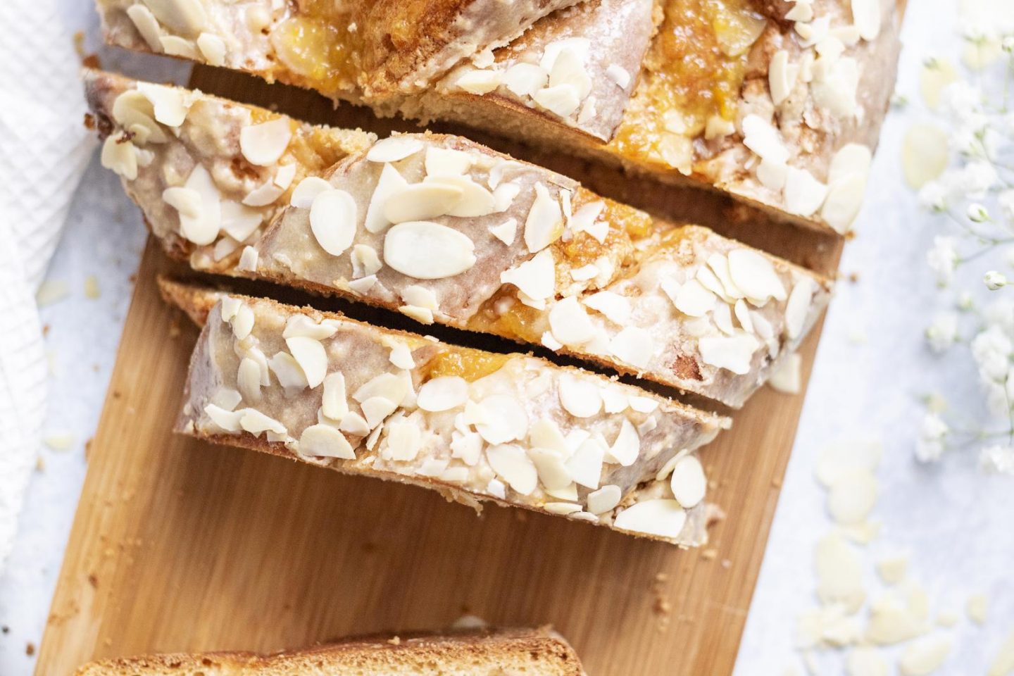 A sliced vegan Easter bake on a wooden board