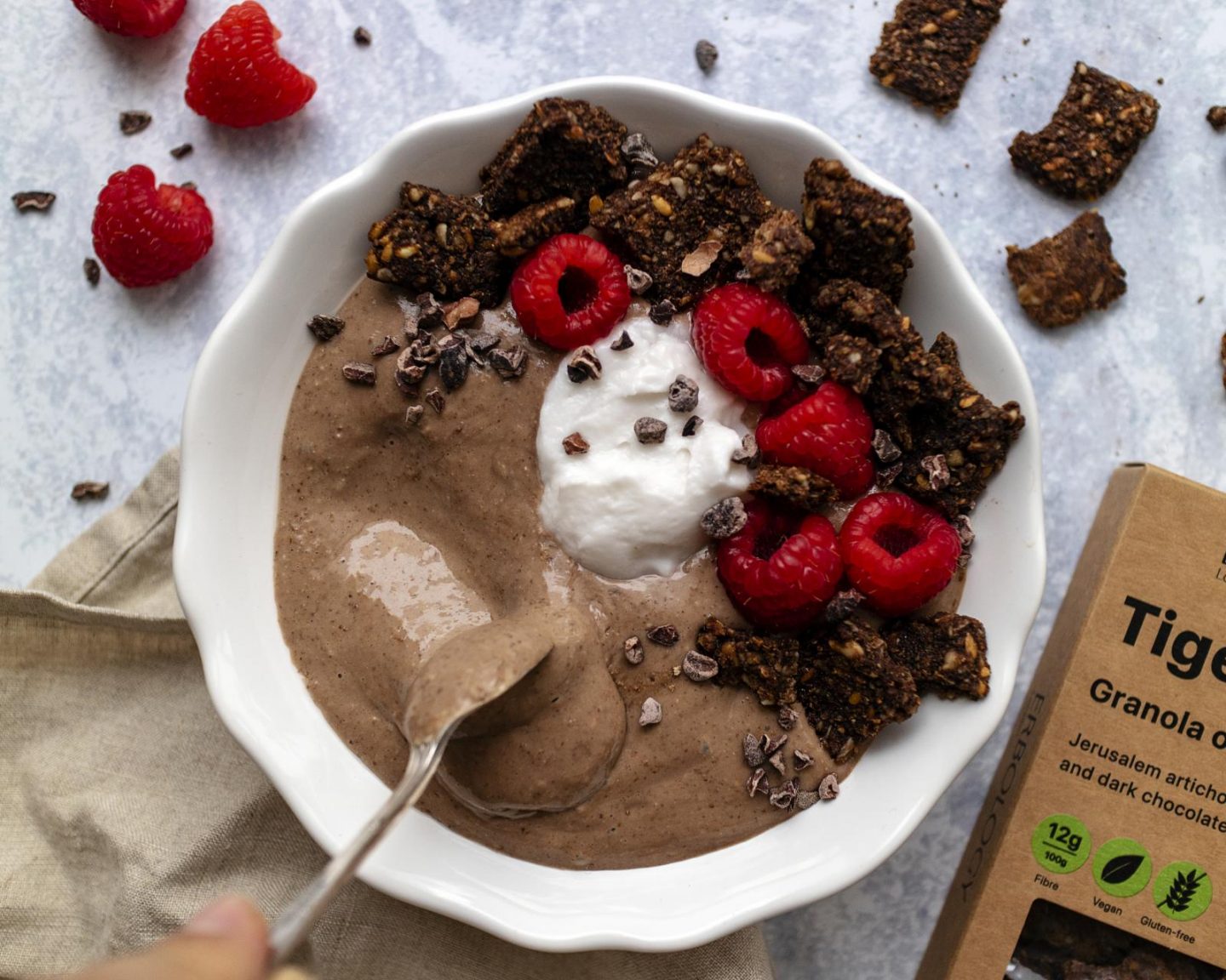 a spoon digging into the smoothie bowl