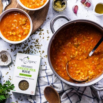 Easy Vegan Orzo Soup in a saucepan on the dinner table