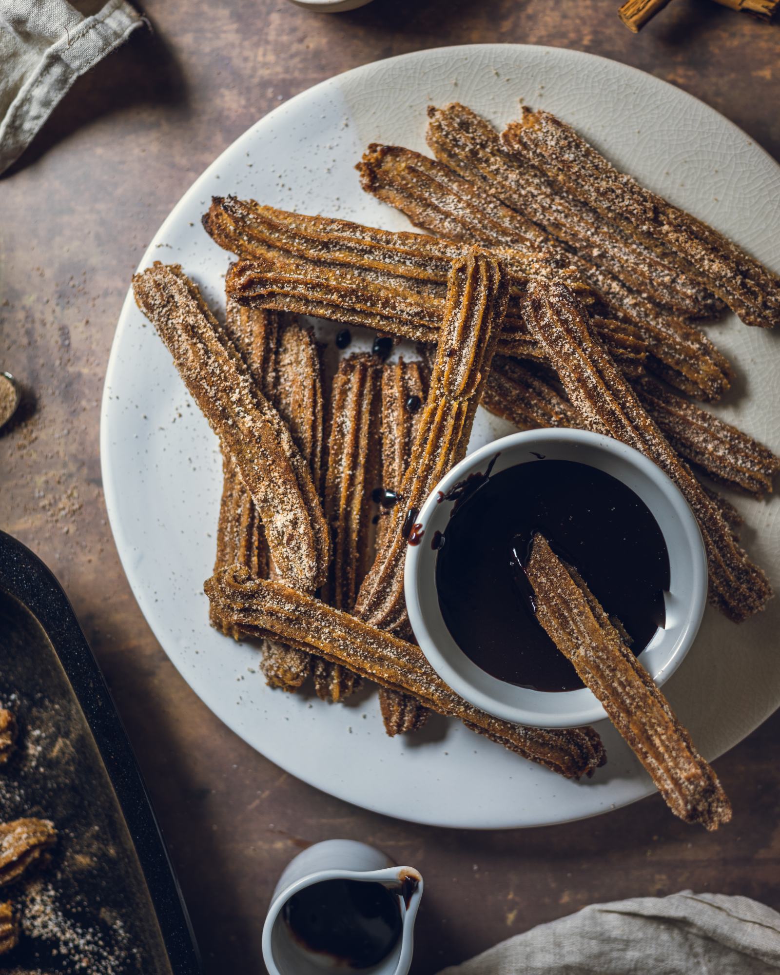 a plate filled with Vegan Churros