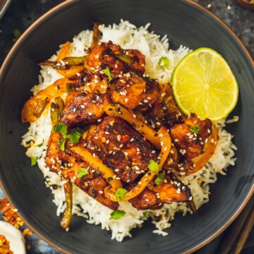 Sticky BBQ Tofu on top of a bowl of rice.