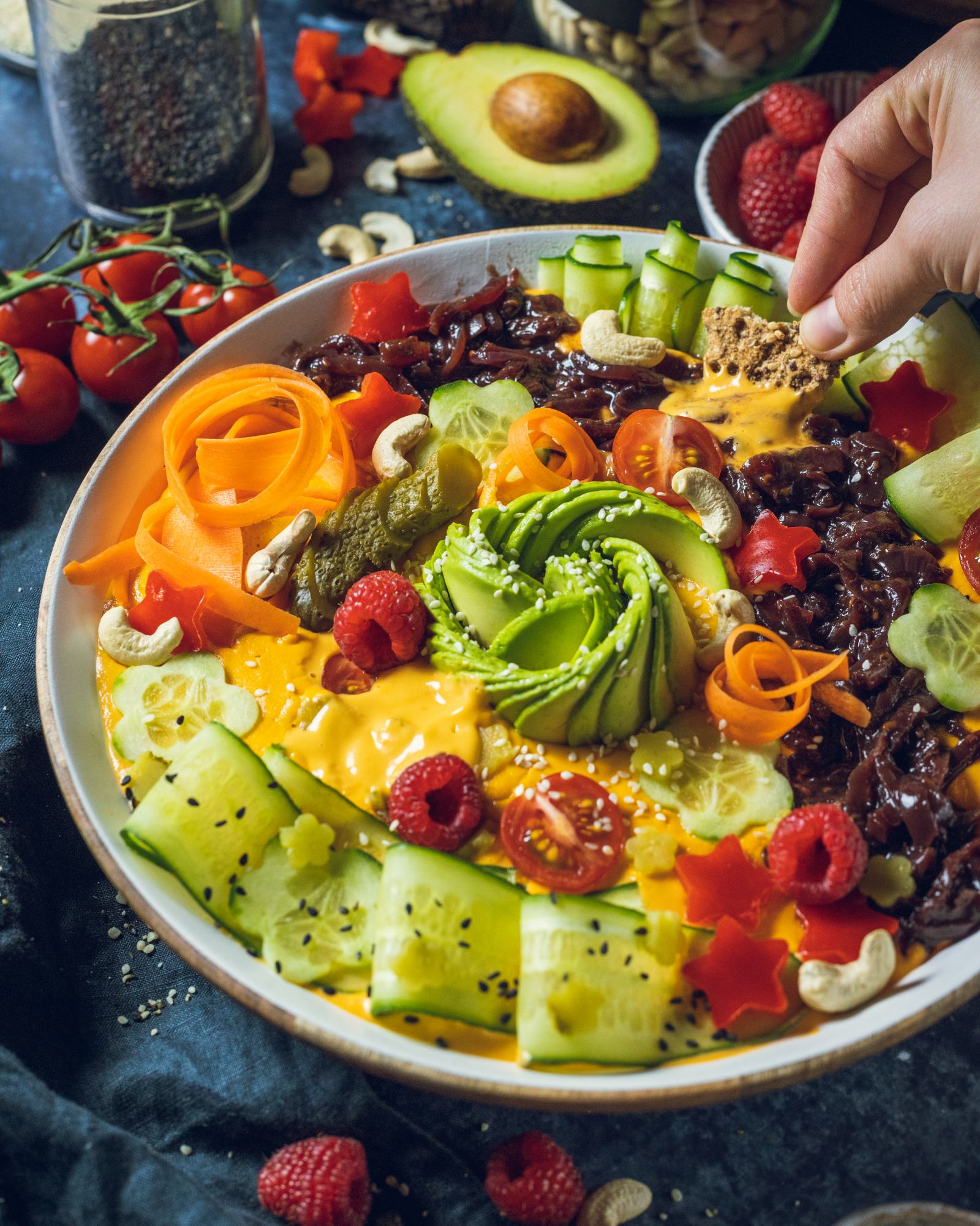 vegan cheese sauce decorated in a large serving platter with toppings