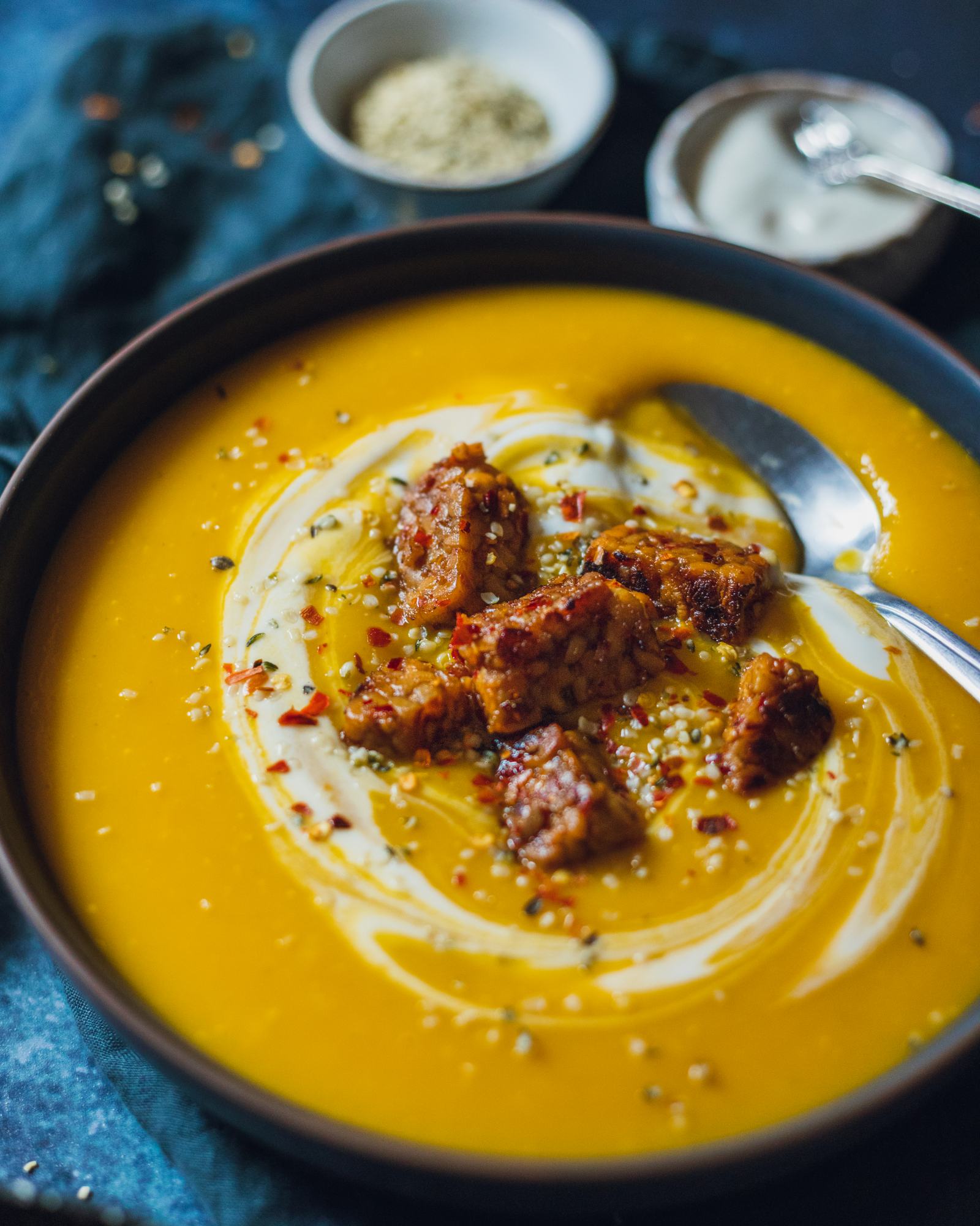 close up of the tempeh on top of the soup