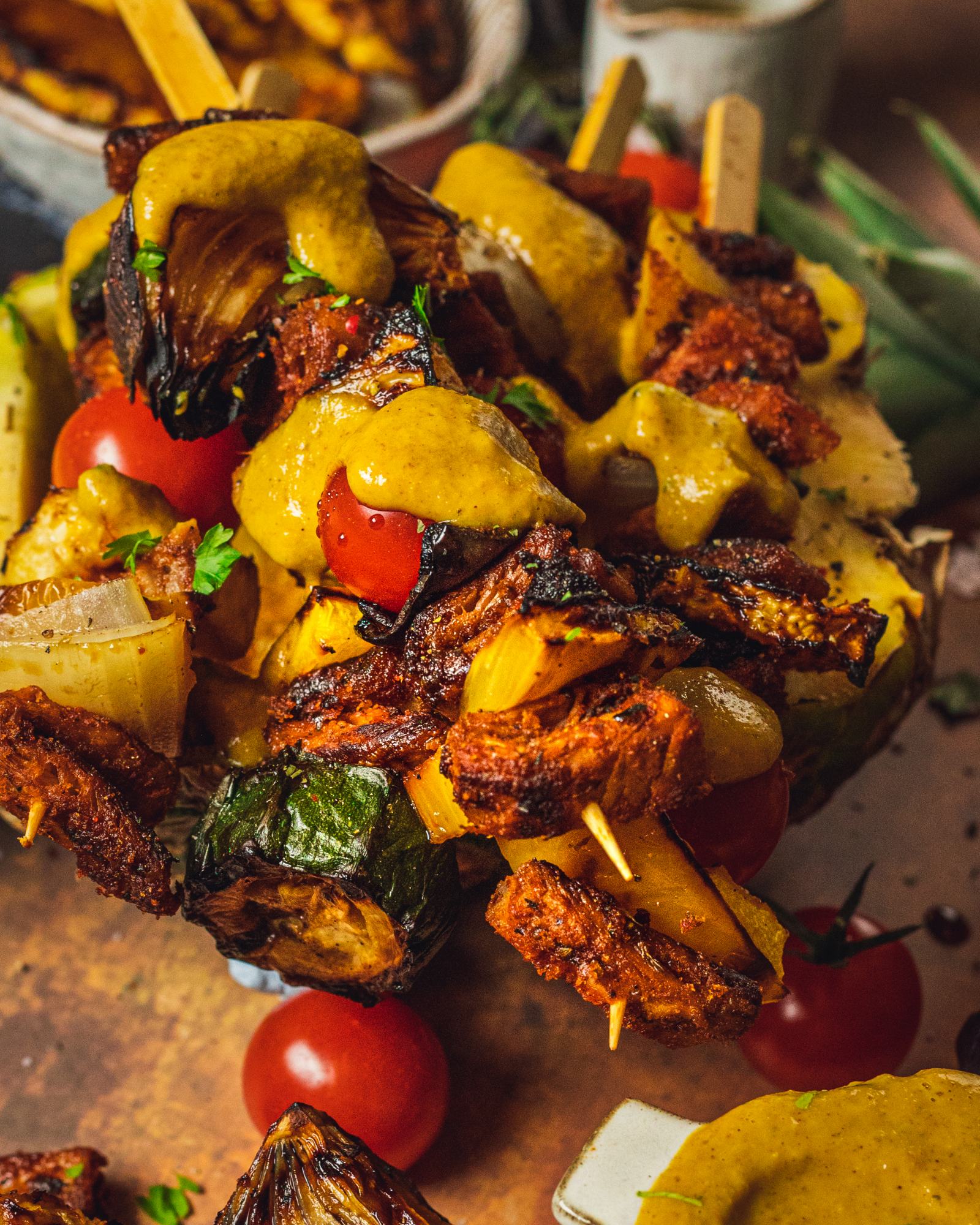 close up of grilled skewers with pineapple bbq sauce drizzled over the top