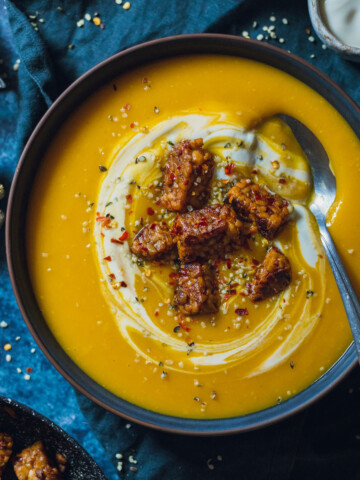 Easy swede Soup with Ginger in a dark bowl on a dark marble tabletop