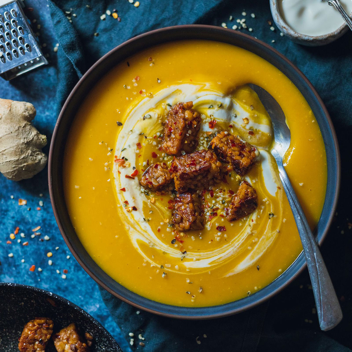 Easy swede Soup with Ginger in a dark bowl on a dark marble tabletop