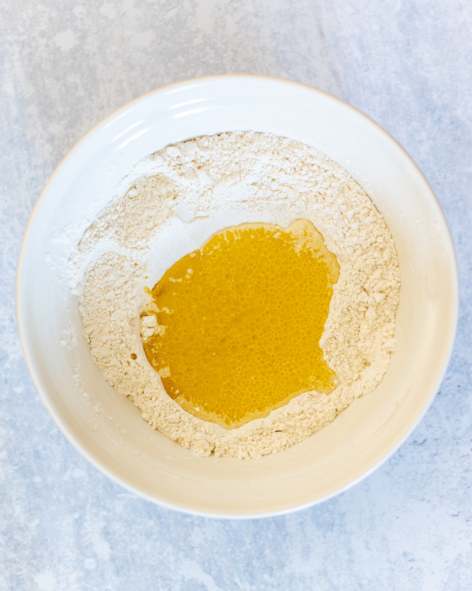 wet ingredients added to the flour bowl