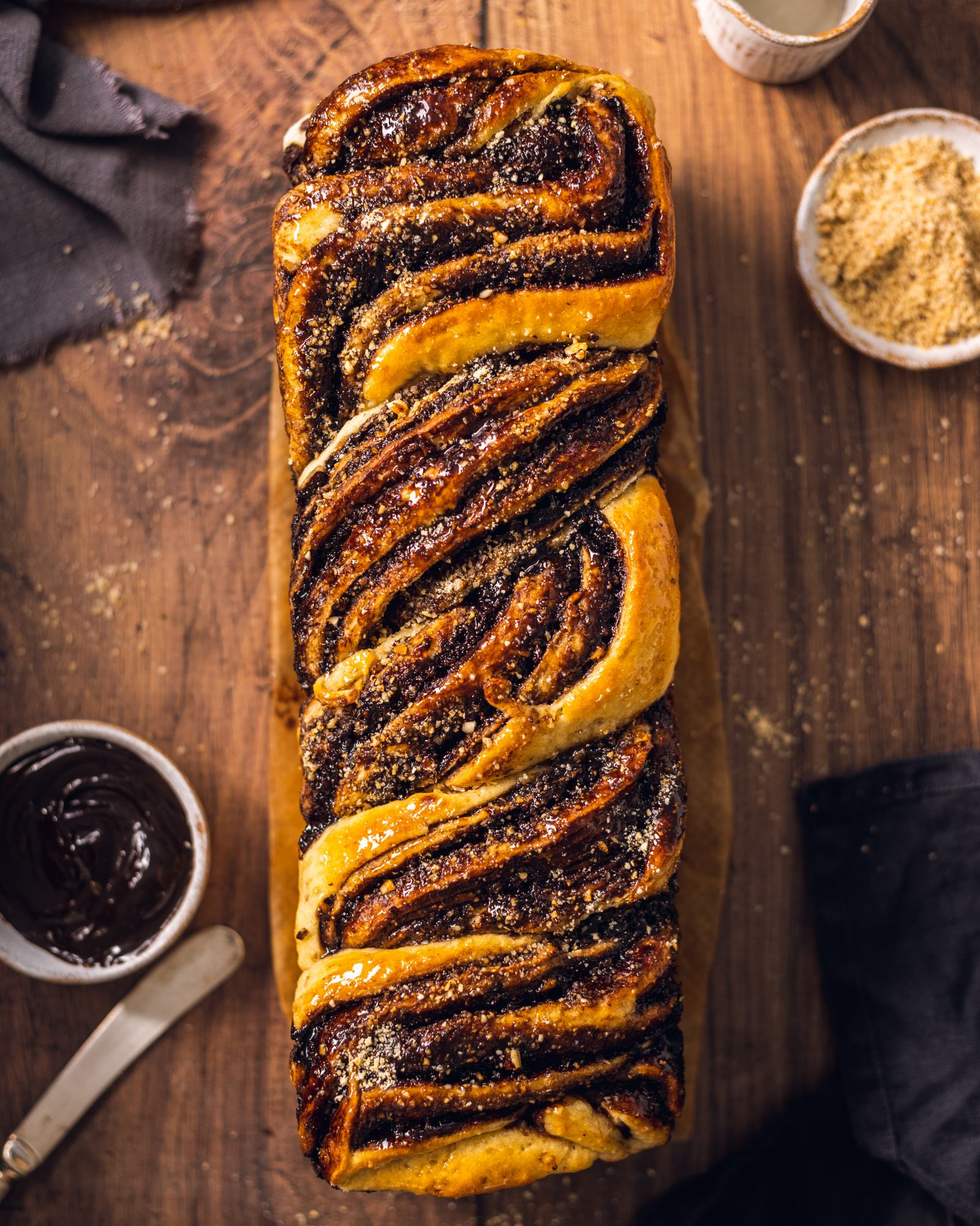 chocolate hazelnut babka photographed from above with the marbling clearly visible