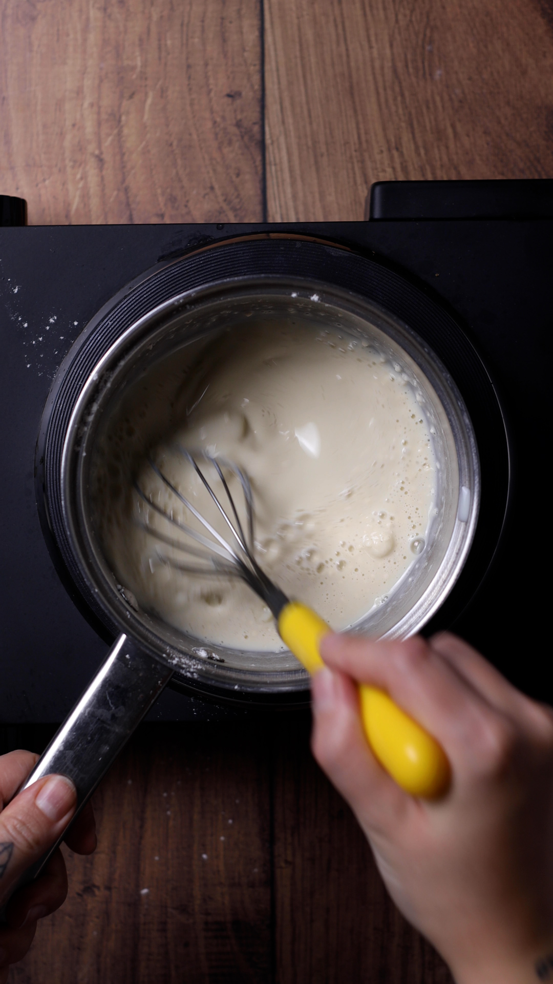 Milk and flour whisked in a saucepan.