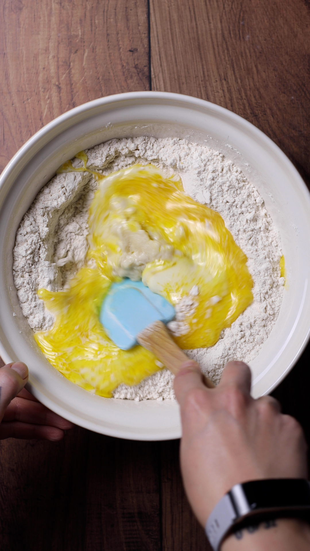 A spatula combining the ingredients for the dough.