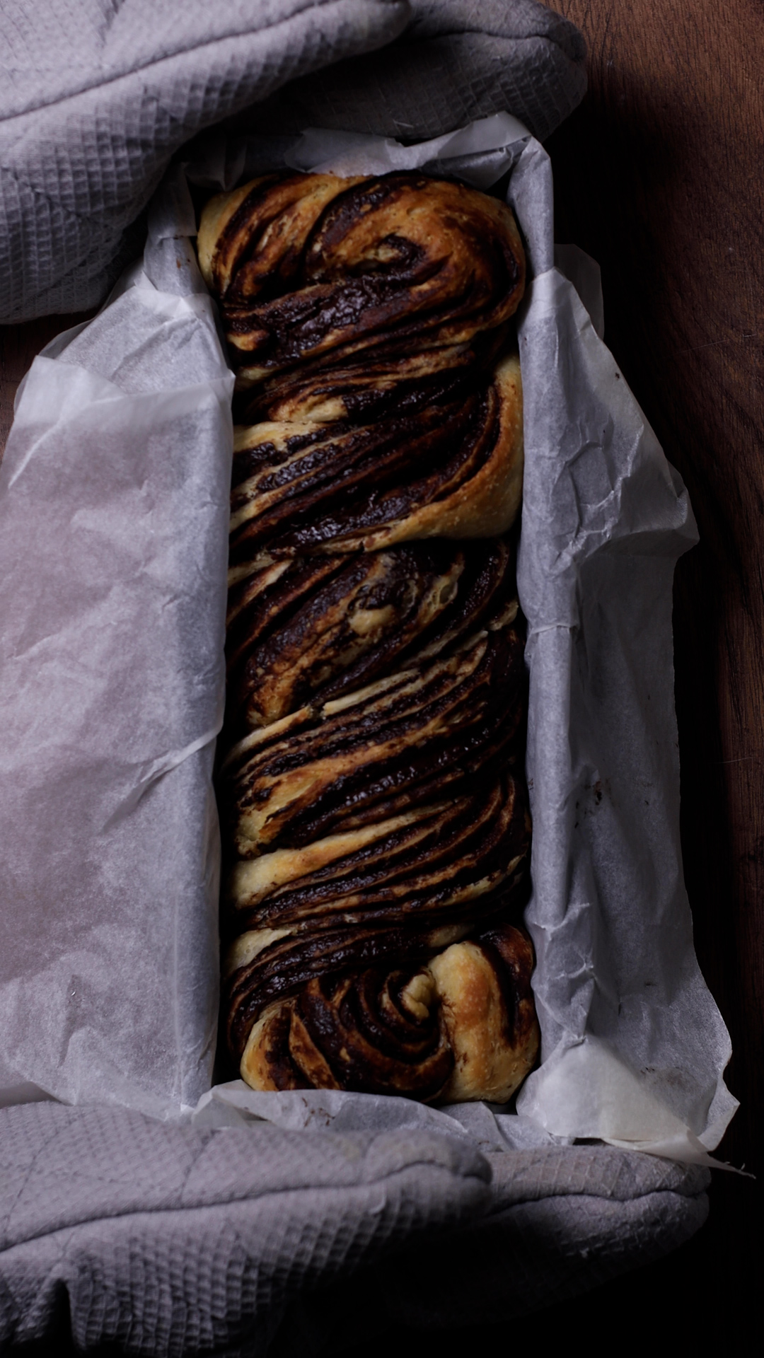 the twisted babka in a loaf tin after baking
