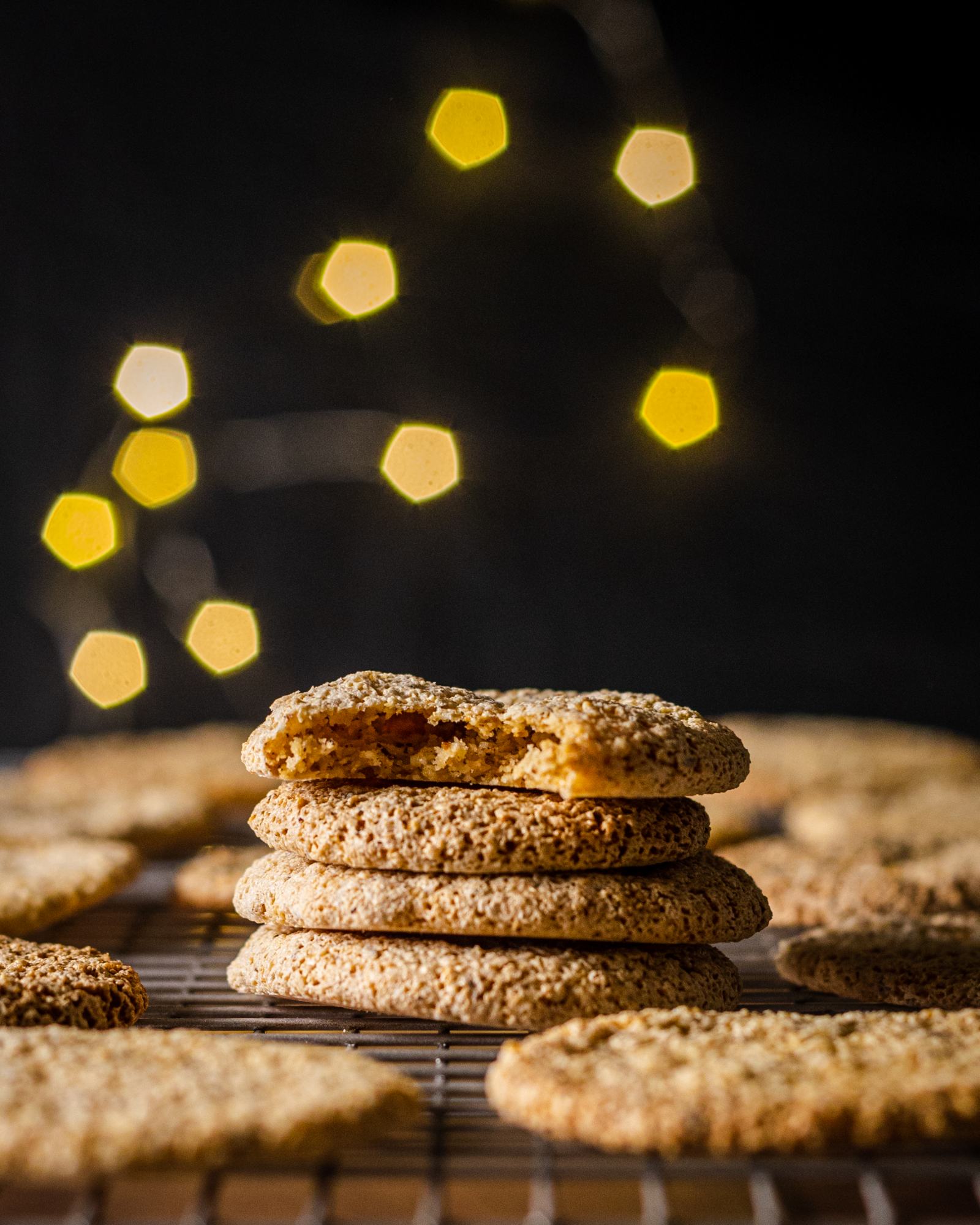 A stack of vegan macaroons, German style with fairy-lights in the background