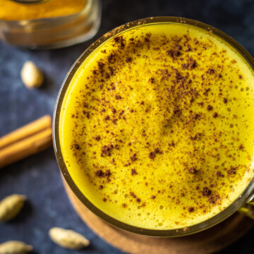 vegan turmeric latte in a glass mug