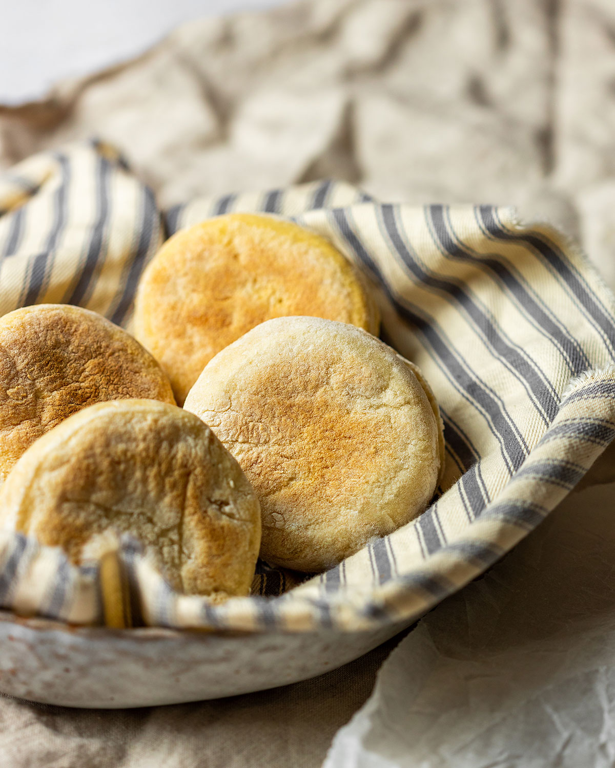 Sourdough English Muffins Recipe (sourdough discard recipe) Sourdough English Muffins Recipe Vegan Sourdough Discard Recipe, 4 sourdough english muffins in a bowl