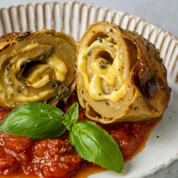 grilled stuffed vegan chicken rolls on a plate