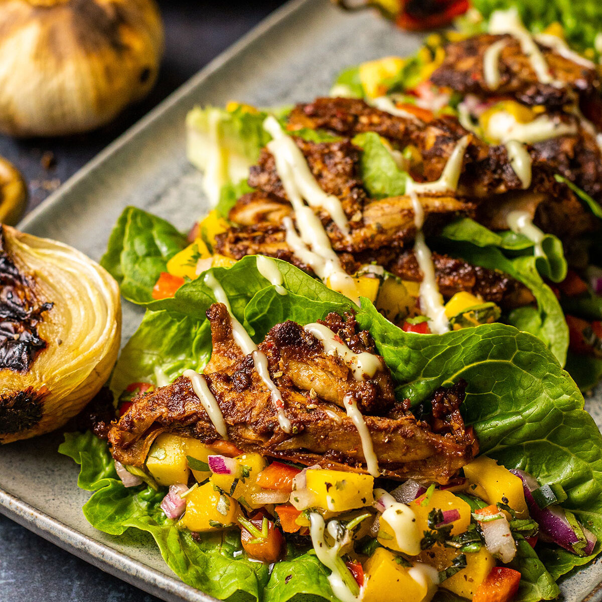 grilled mango salsa lettuce tacos on a serving platter