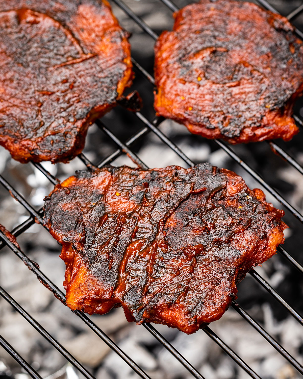 3 vegan chicken fillets on the barbecue