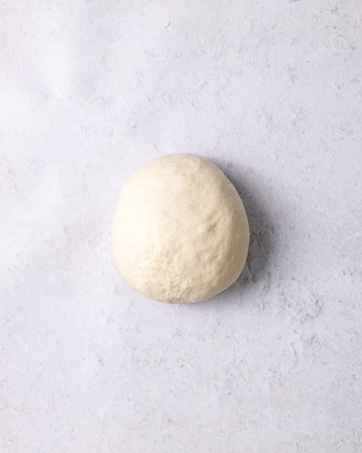 smooth doughball on a kitchen surface