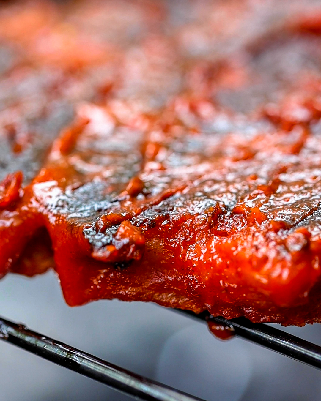 vegan grilled chicken up close seared and coated in vegan BBQ sauce