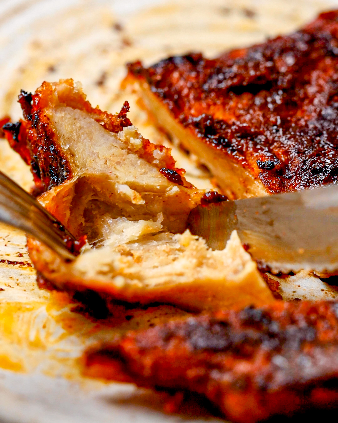 a knife cutting into the grilled seitan chicken