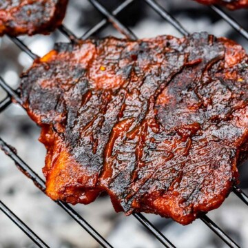close up of a 3 vegan chicken fillets on the grill
