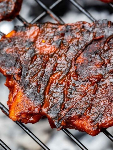 close up of a 3 vegan chicken fillets on the grill