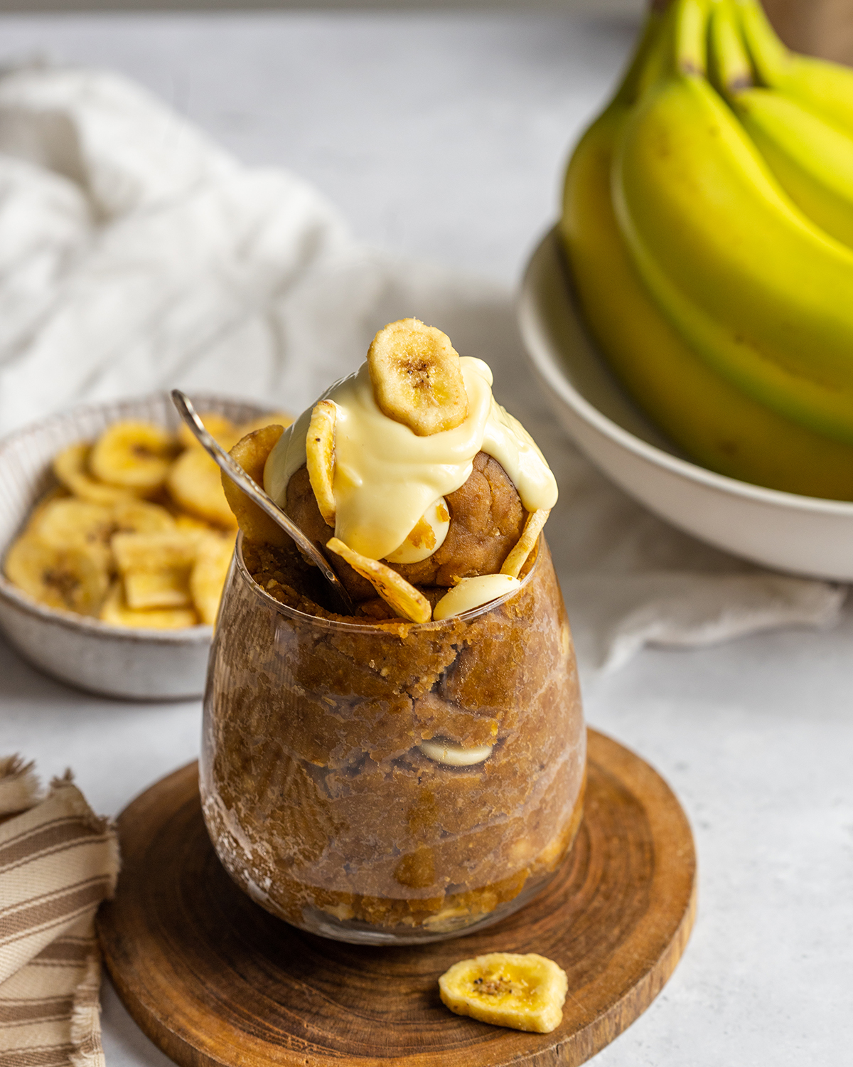 a jar of vegan cookie dough surrounded by ingredients