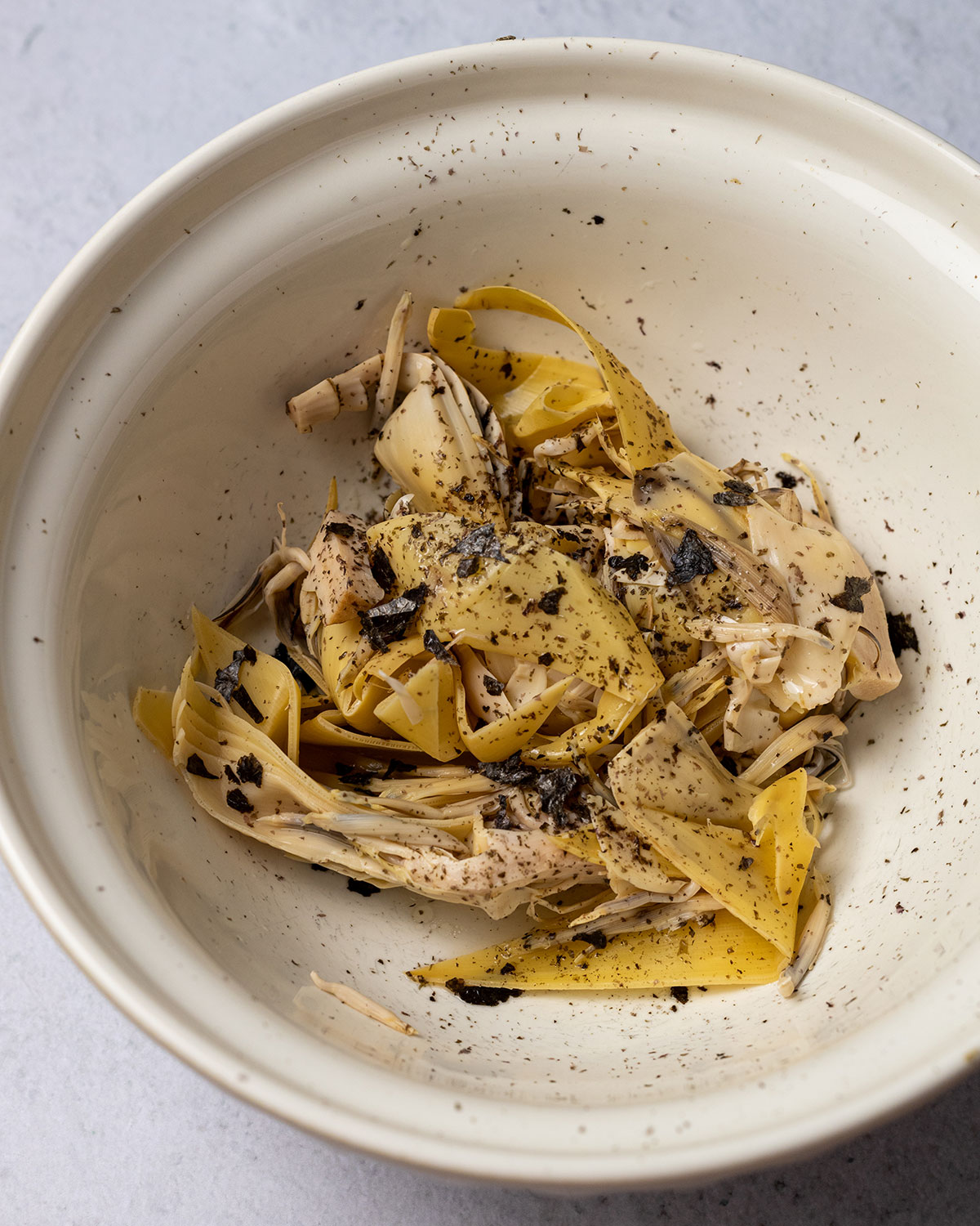 banana blossom and marinade in a large bowl