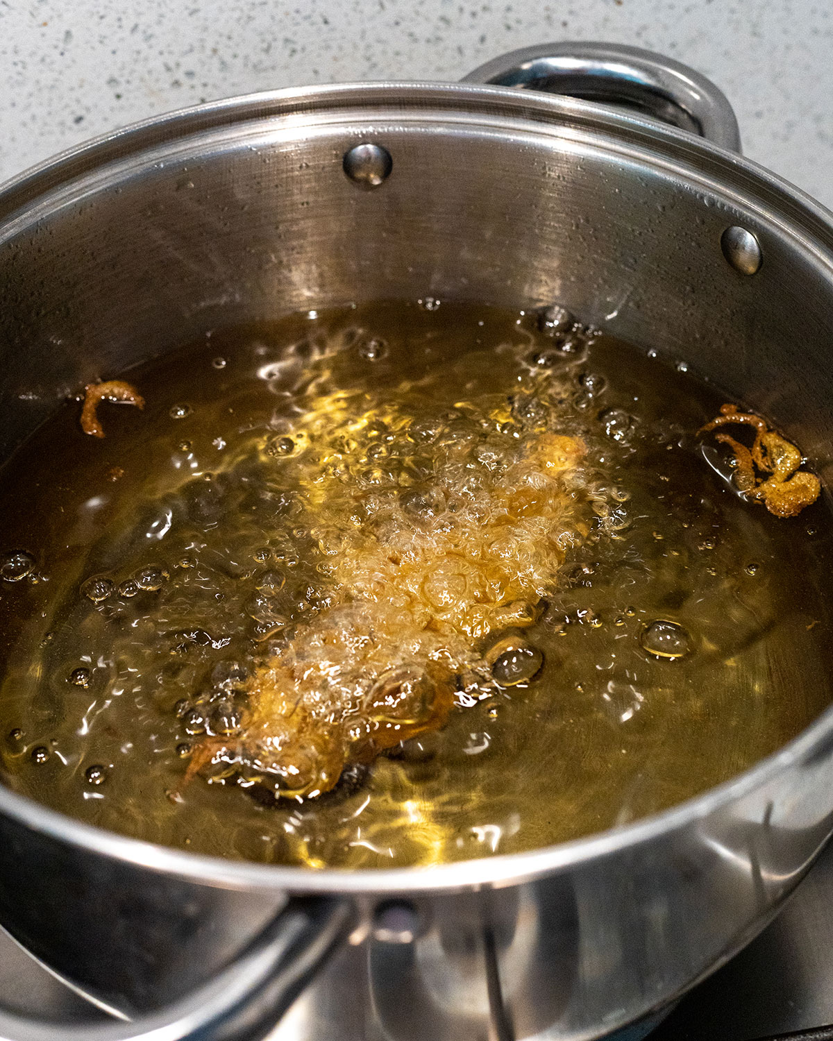 vegan banana blossom fish frying in hot oil