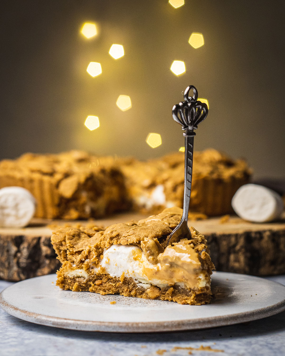 a slice of marshmallow peanut butter pie with a fork stuck in it