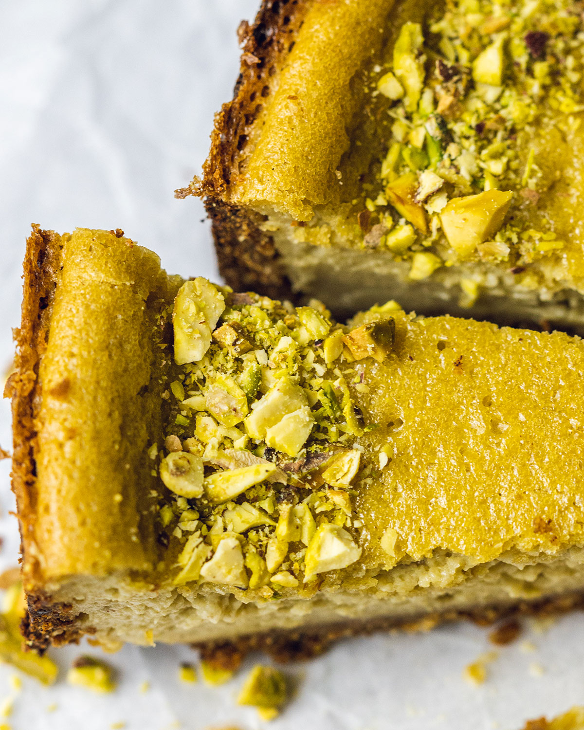 Pistachio nuts on a cheesecake slice