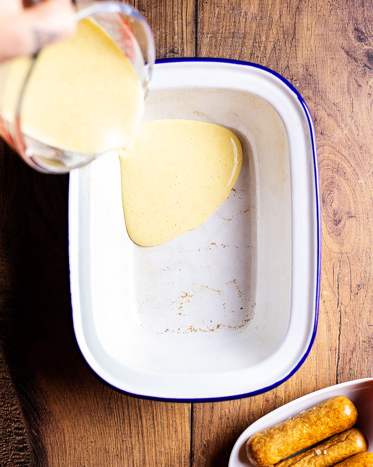 pouring the batter into the oven dish