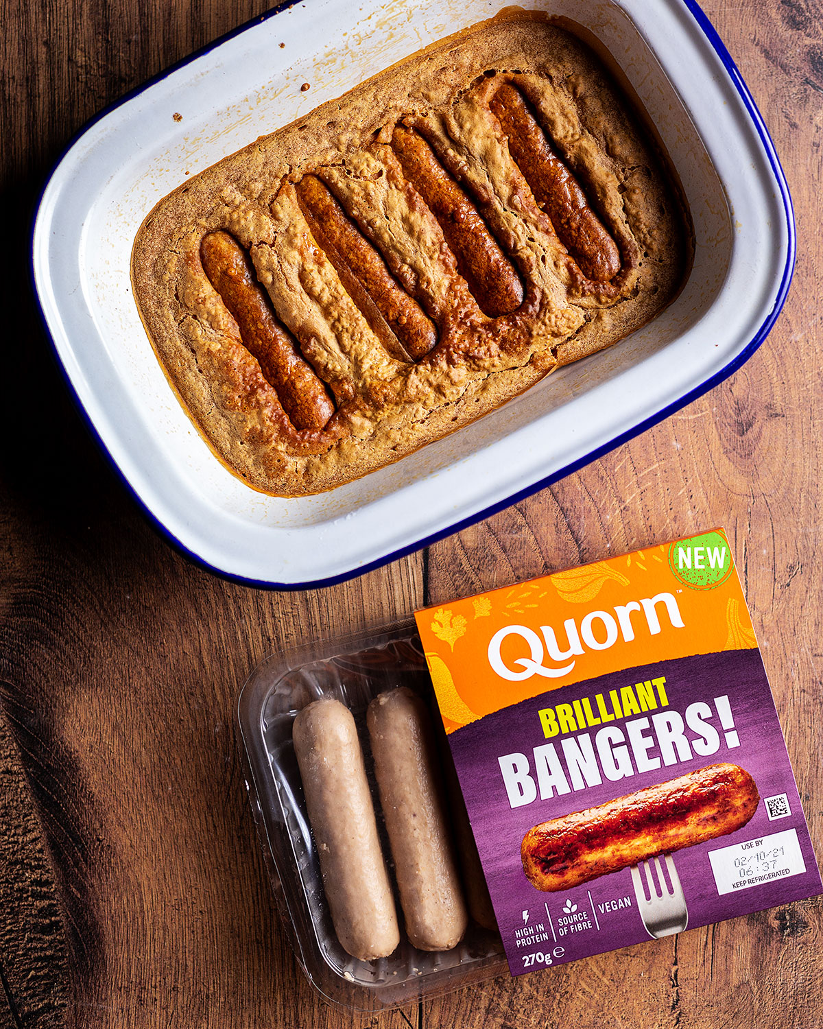 A pack of Quorn Brilliant Bangers next to vegan toad in the hole