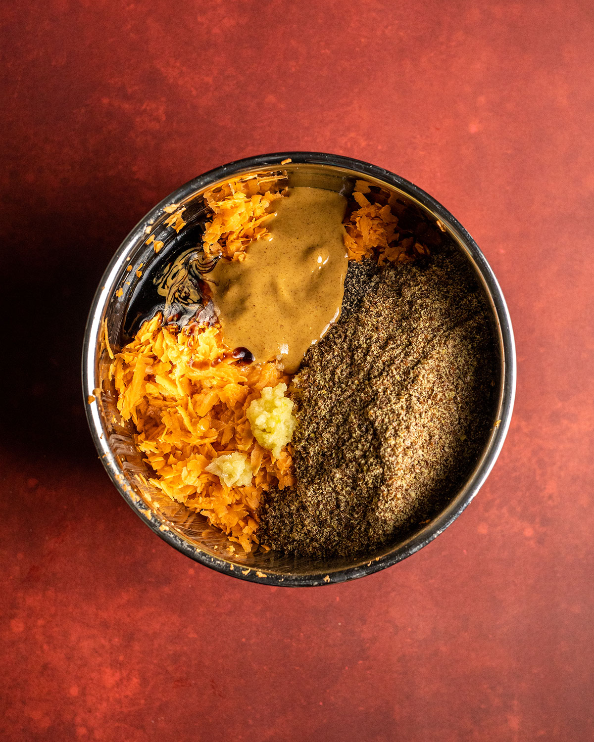 the rest of the ingredients added to the bowl with the sweet potato shreds