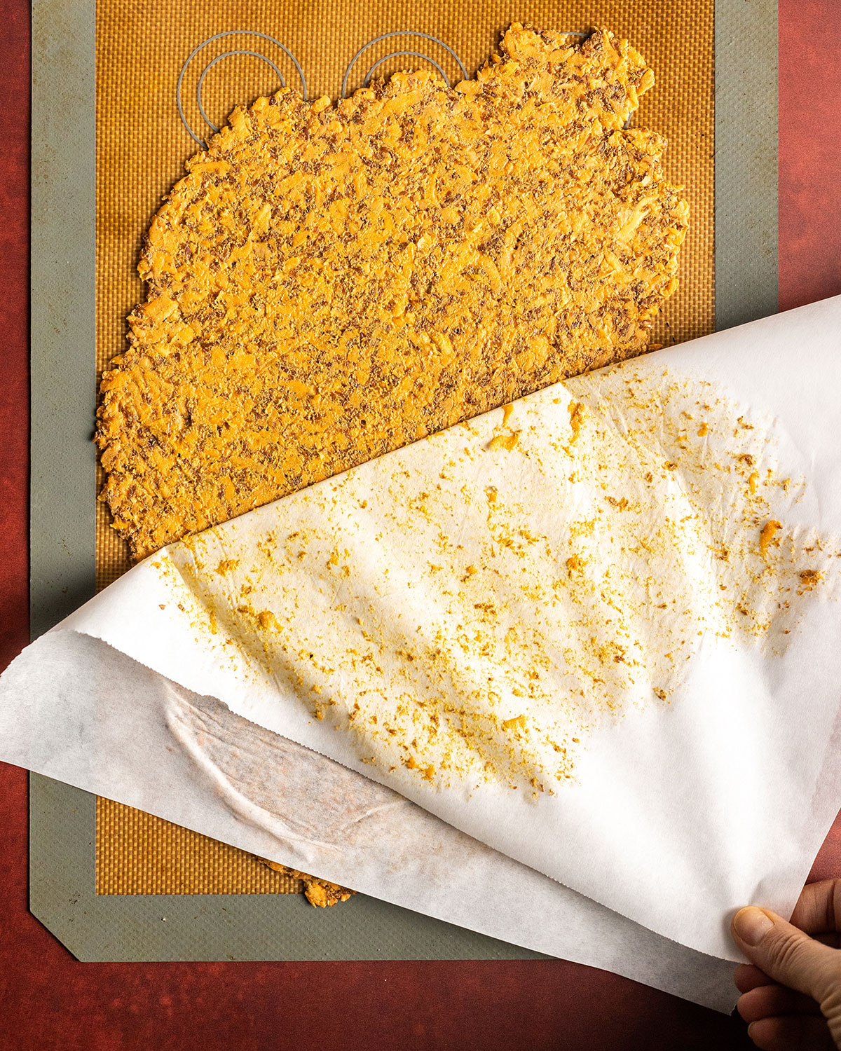 removing the parchment paper from the ready rolled cracker dough