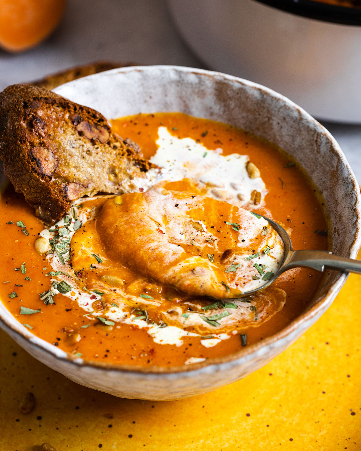 a spoon in a bowl full of soup