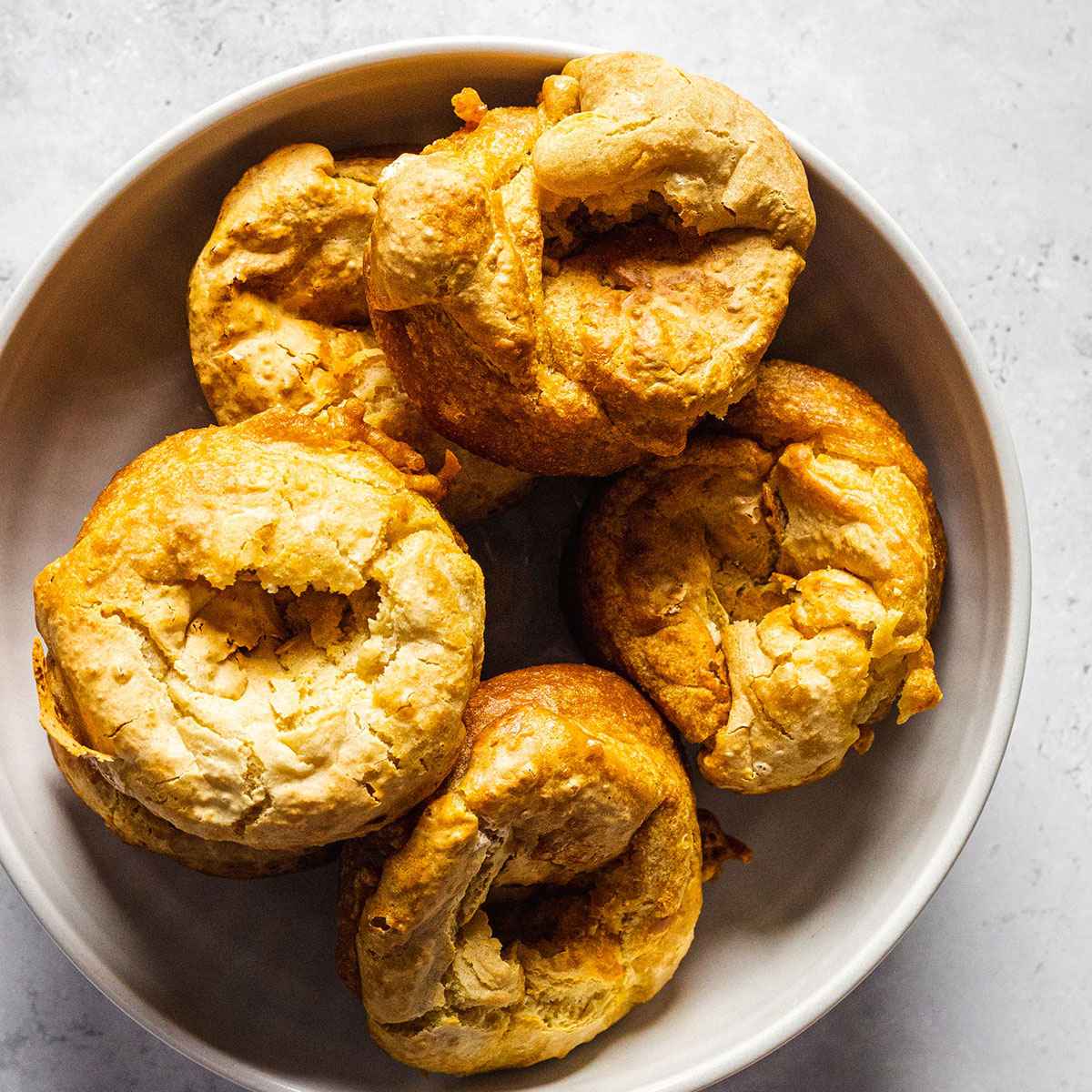 A bowl full of vegan Yorkshire puddings photograph from above