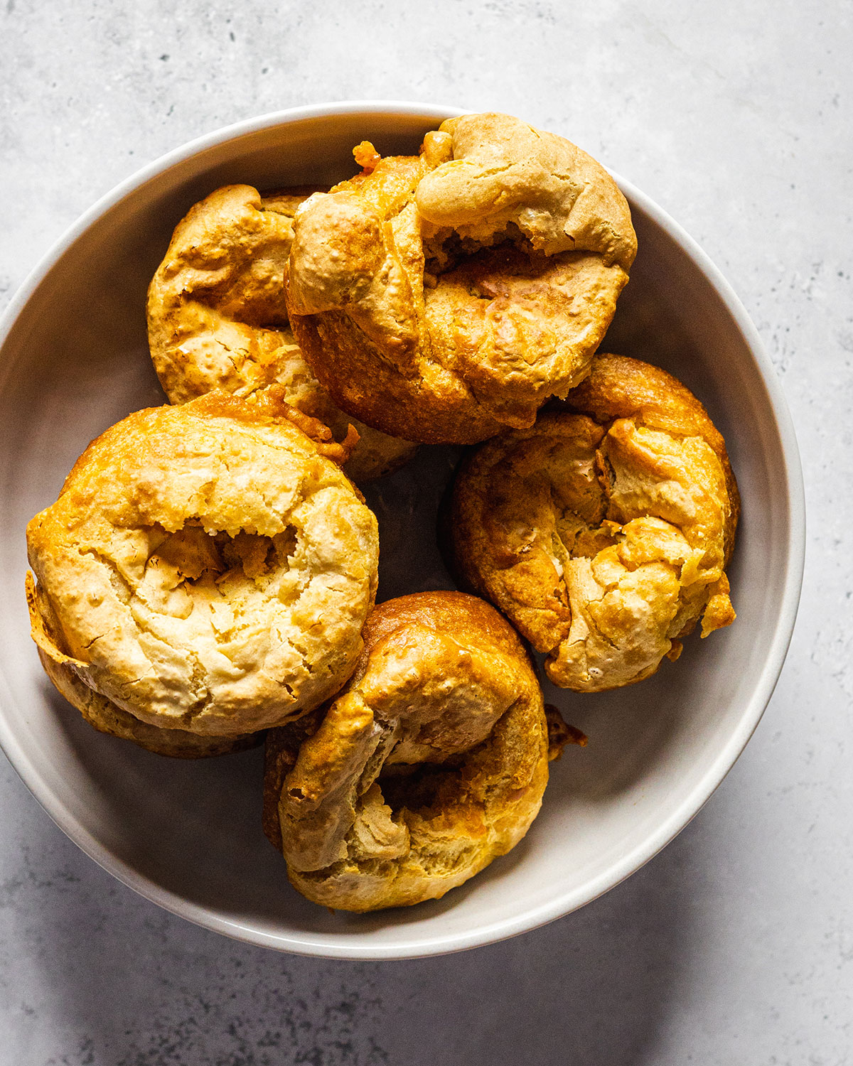 A bowl full of vegan Yorkshire puddings photograph from above