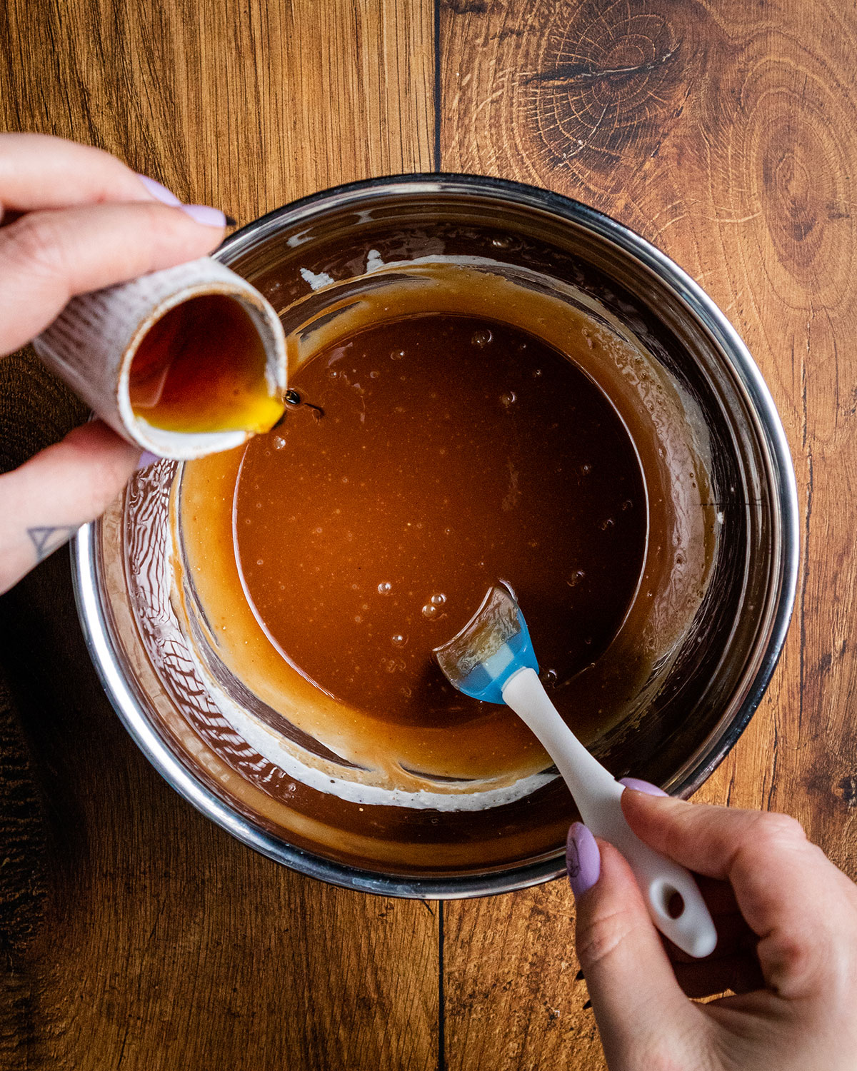 maple syrup being added to the bowl