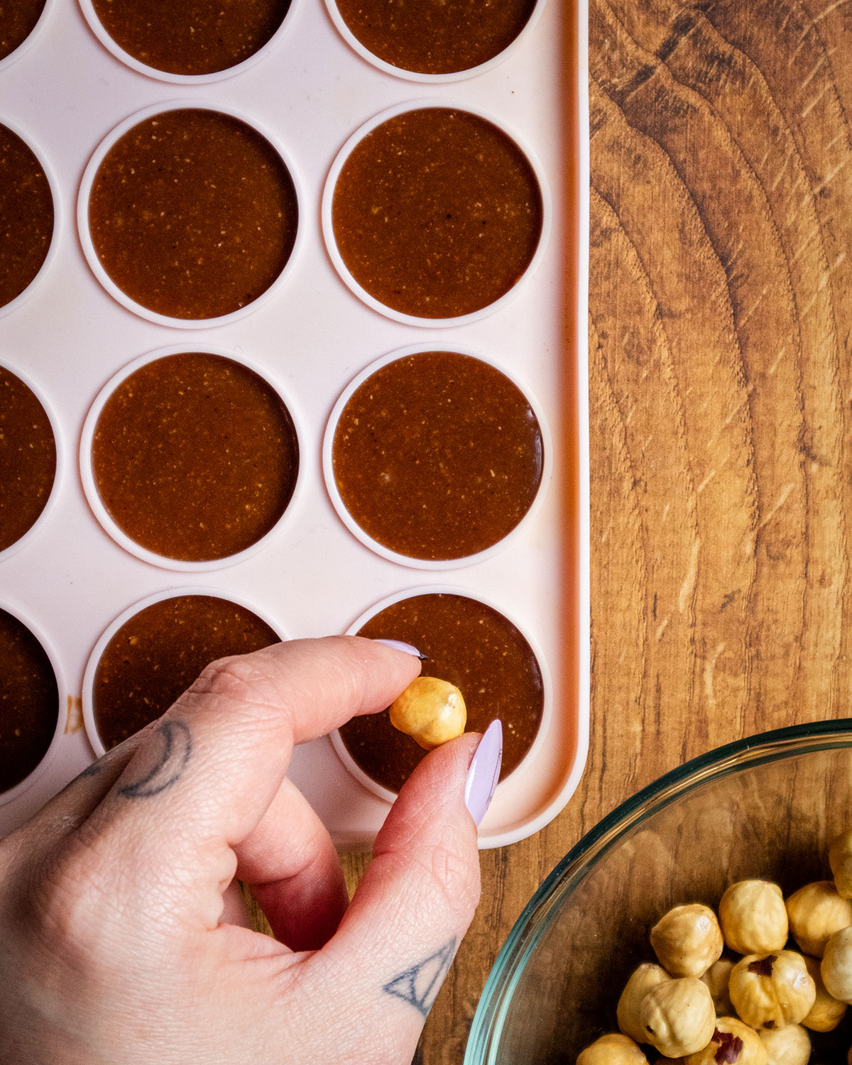 Hazelnuts being added to the vegan Ferrero Rocher filling