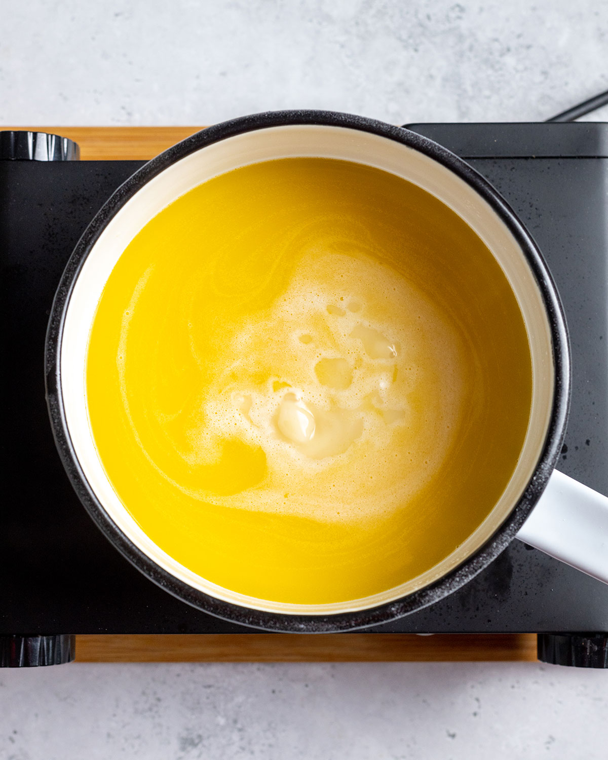 Ingredients for vegan lemon curd in a saucepan