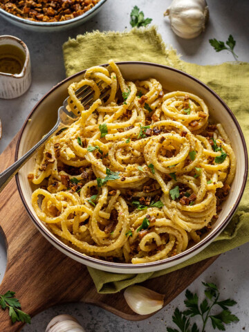 homemade vegan carbonara pasta with spaghetti and smoked tofu bacon bits