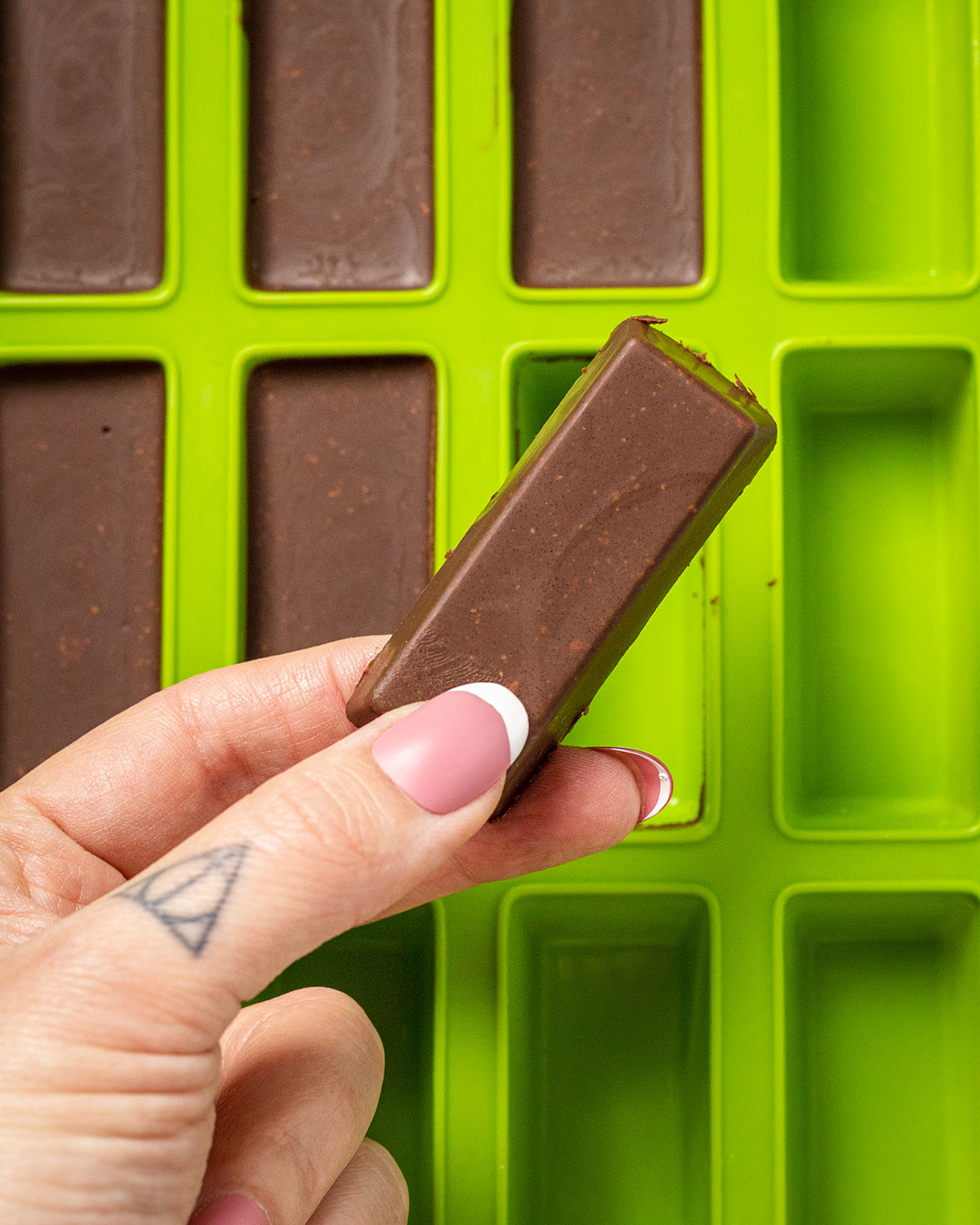 a hand holding chocolate fudge