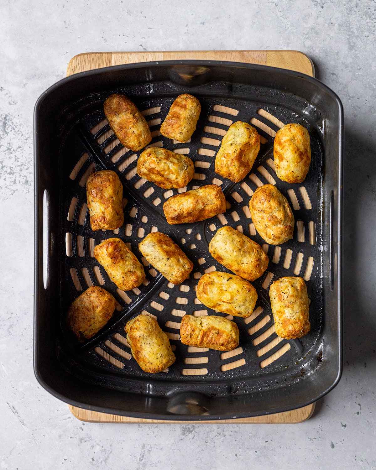 cooked tater tots in an air fryer